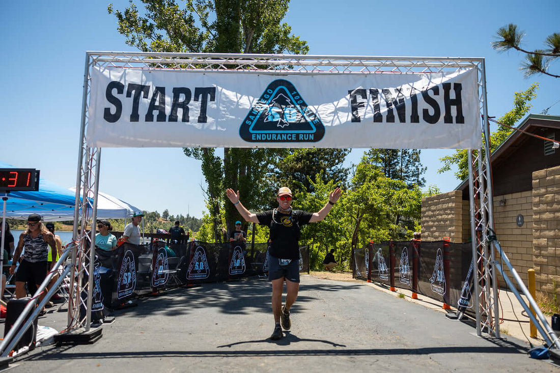 Can I Run an Ultra Marathon: Runner crossing the finish line of the san diego 100.